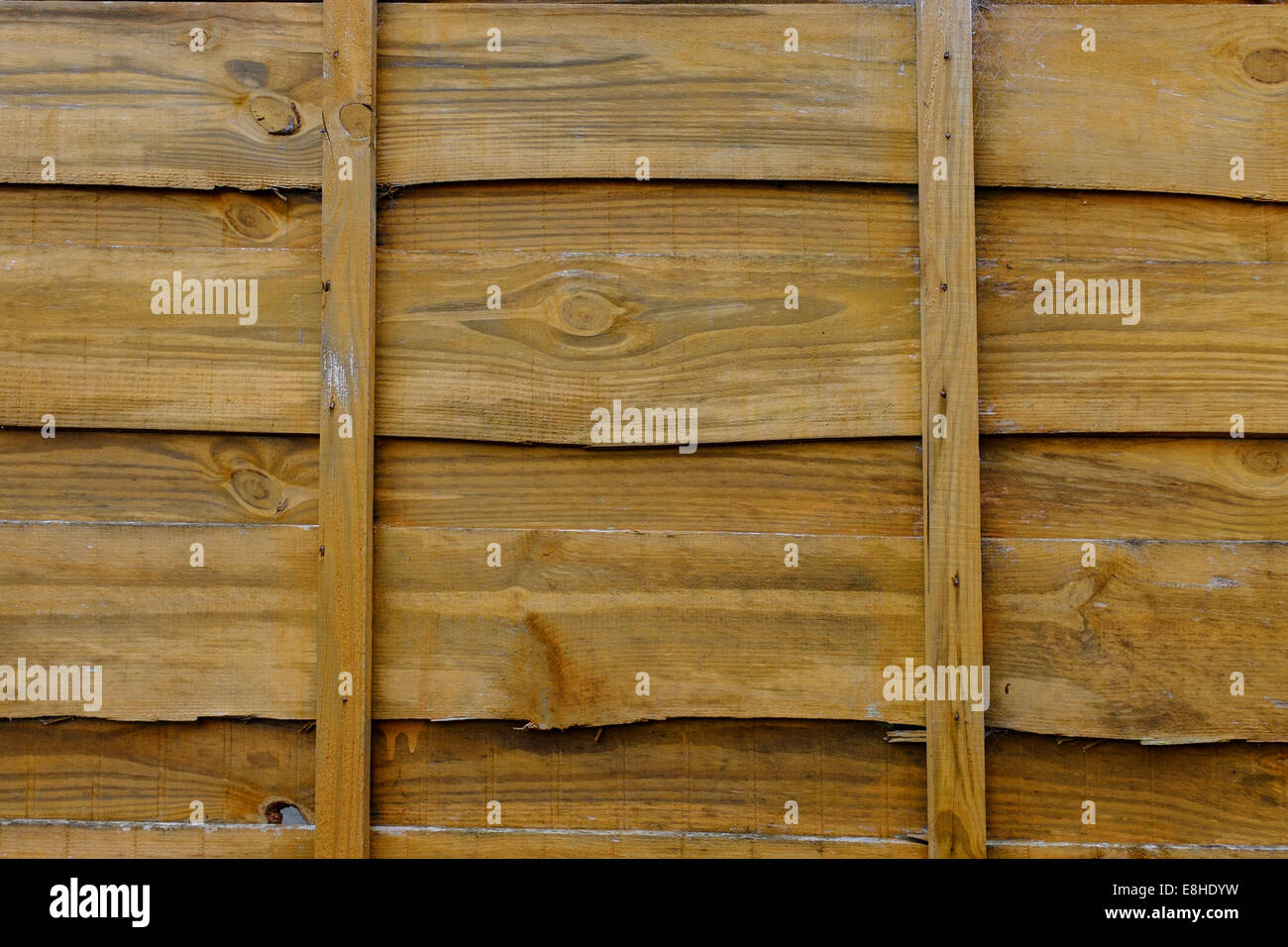 Orange coloured Wooden garden fence Stock Photo Alamy