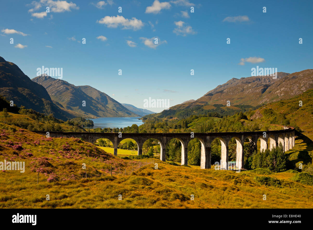 Glenfinnan Viaduct, with Loch Linnhe in background, Lochaber, Scotland, UK Stock Photo