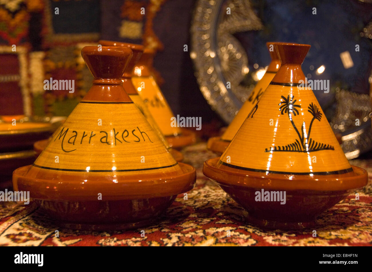 Horizontal close up of traditional earthenware tagines on sale in the souks of Marrakech. Stock Photo