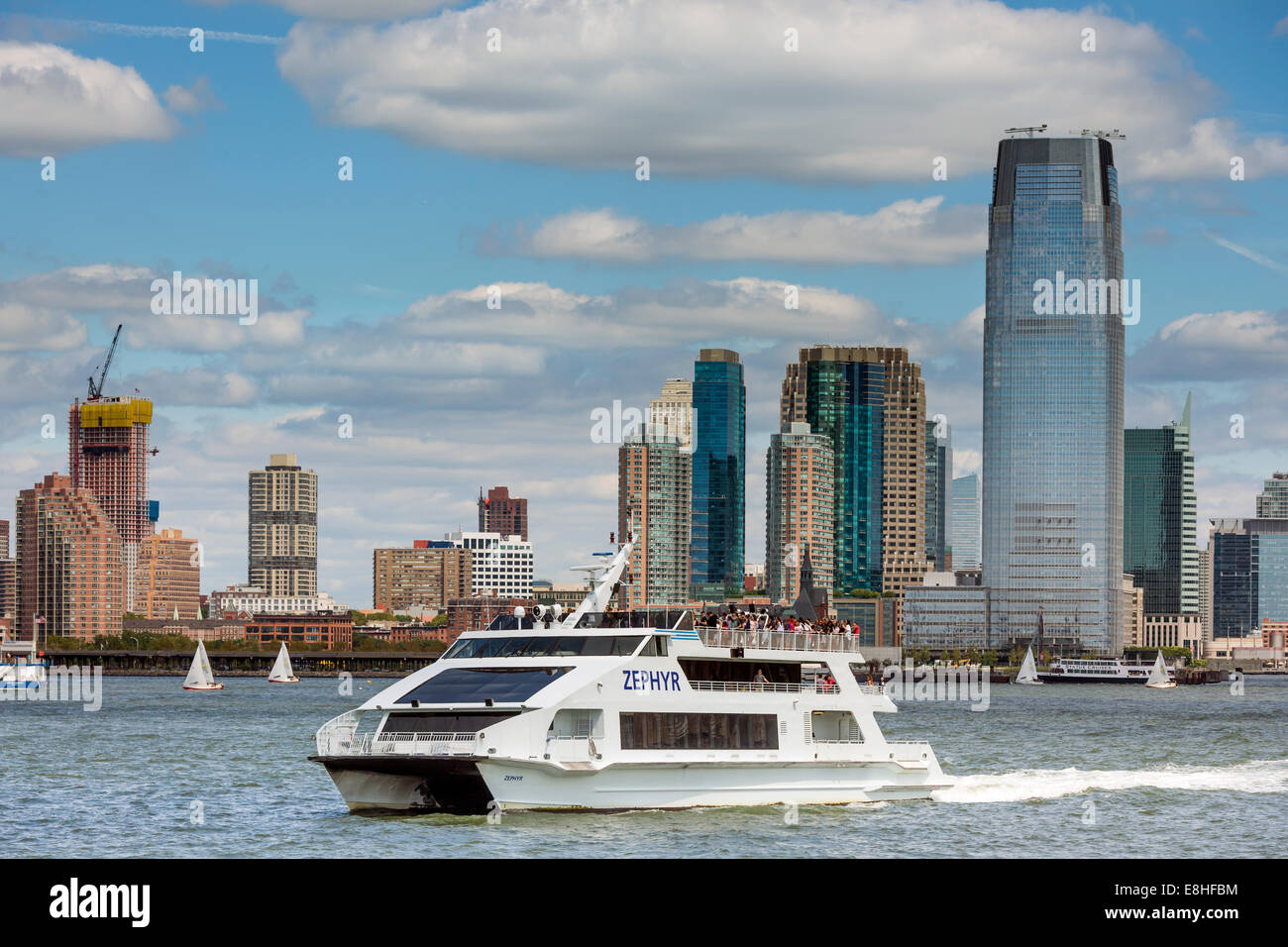 A sightseeing cruise boat sets out from Manhattan for a tour of New York Harbor. Stock Photo