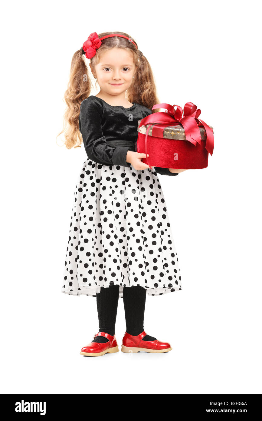 Full length portrait of a cute little girl holding a present isolated ...