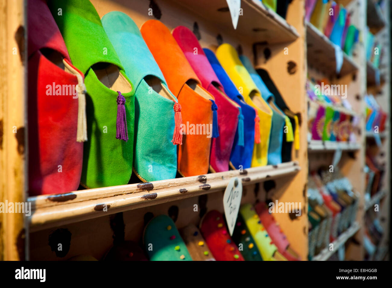 Horizontal close up of colourful suede shoes on sale in the souks of Marrakech. Stock Photo