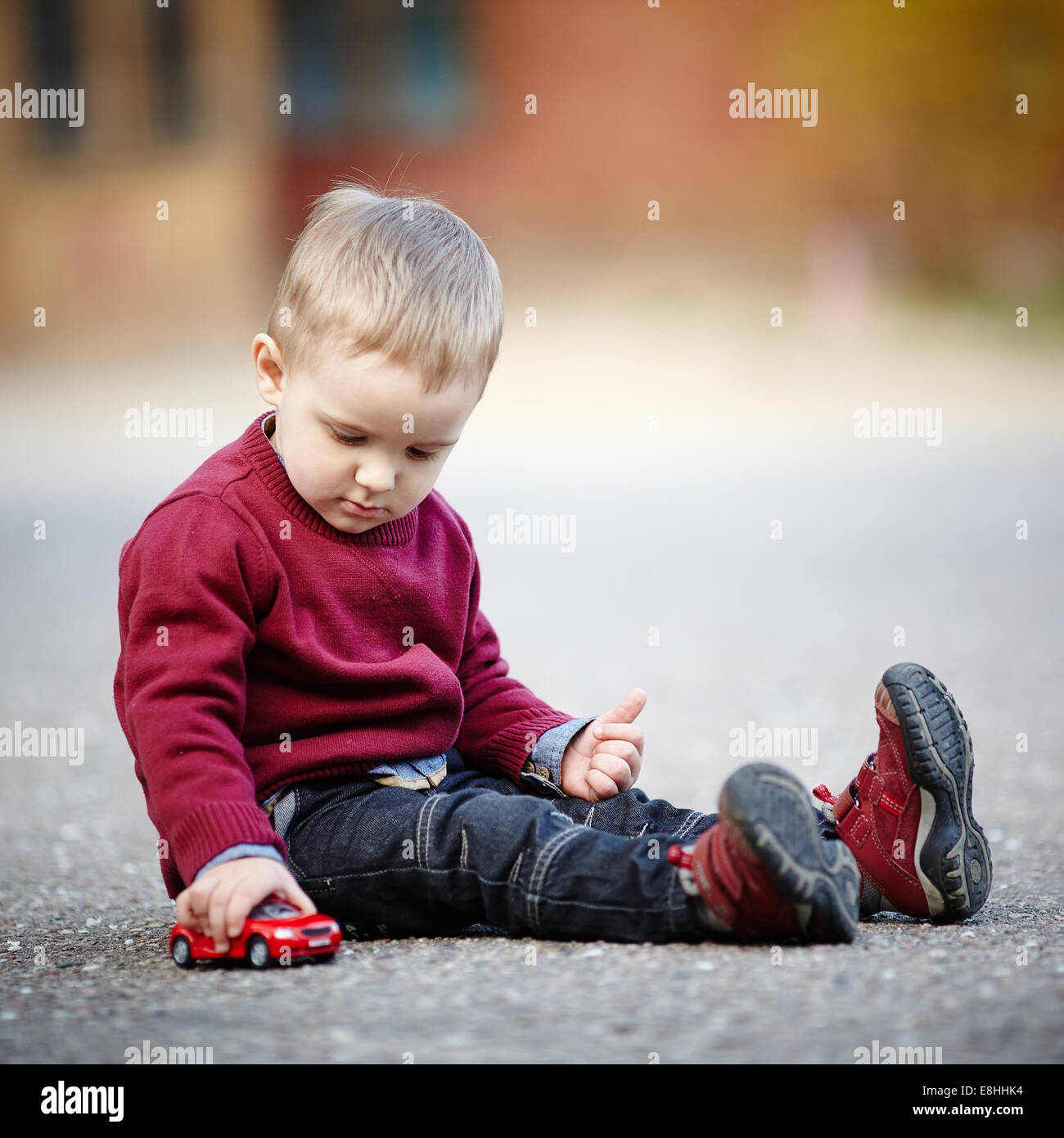 little boy plays with toy car Stock Photo - Alamy