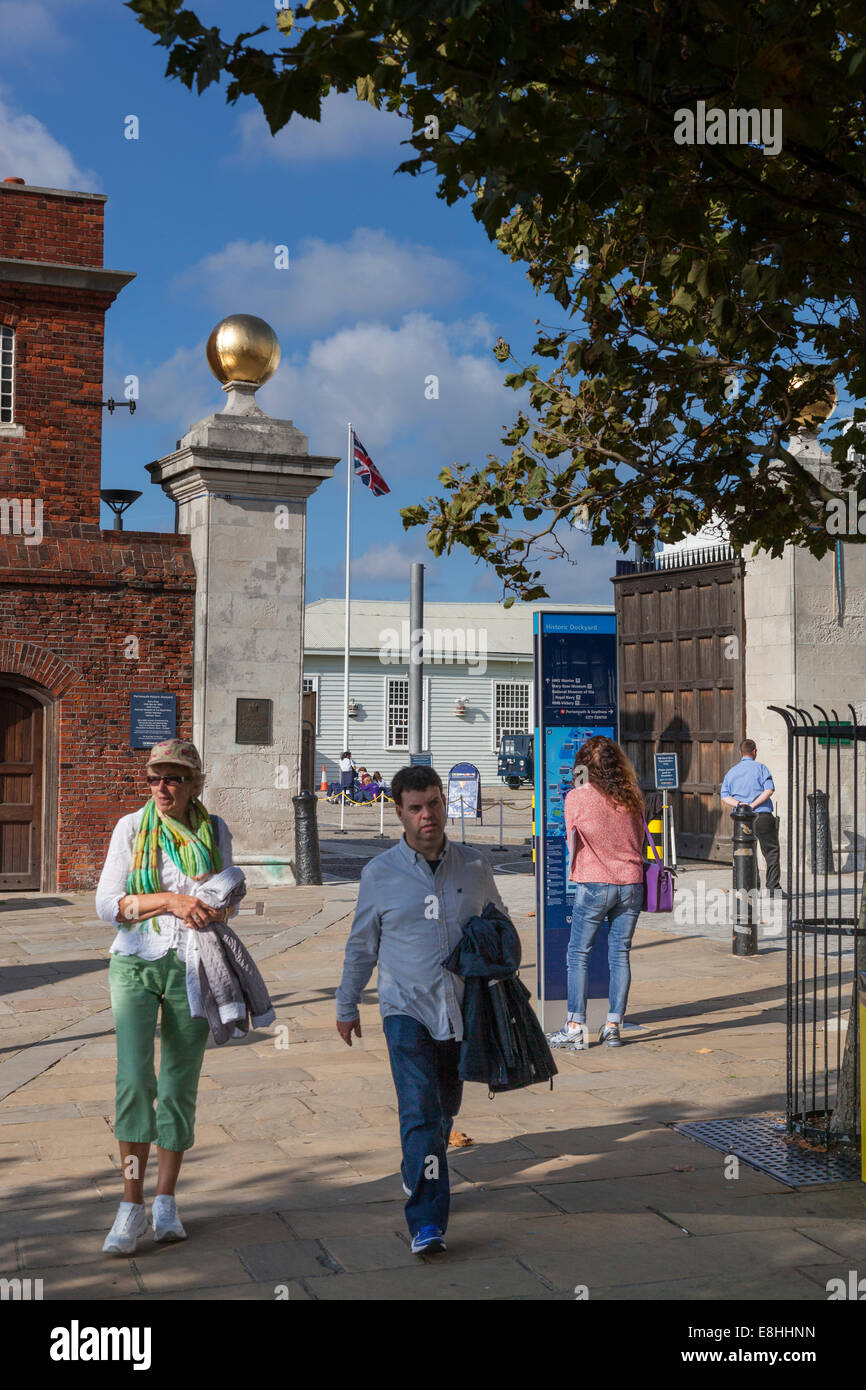 Pedestrians outside the Victory Gate, the main entrance to the Royal Naval Dockyard at Portsmouth. Stock Photo