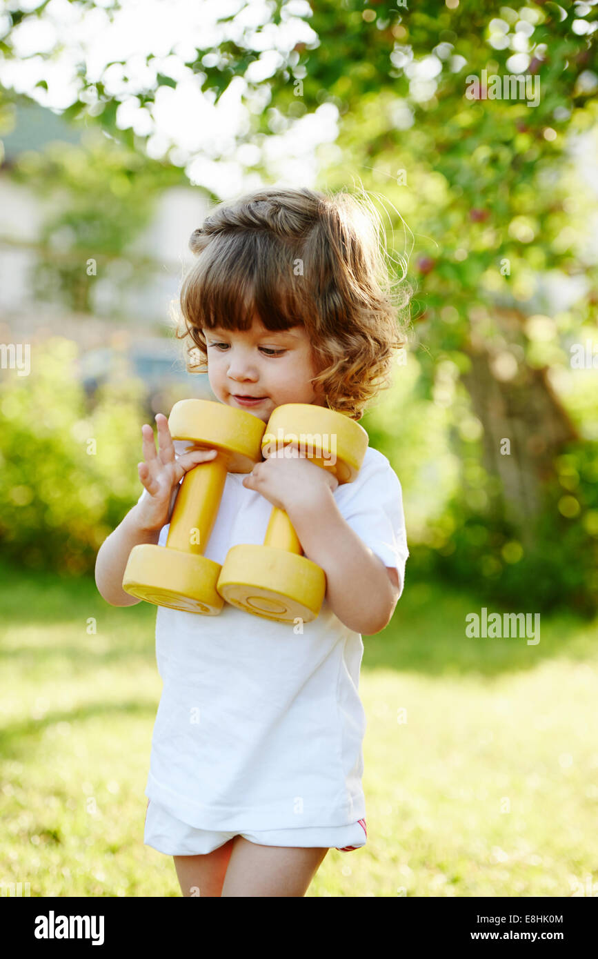cute little girl with dumbbells Stock Photo - Alamy