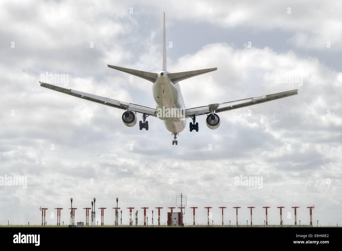 big jet plane landing on airport track Stock Photo