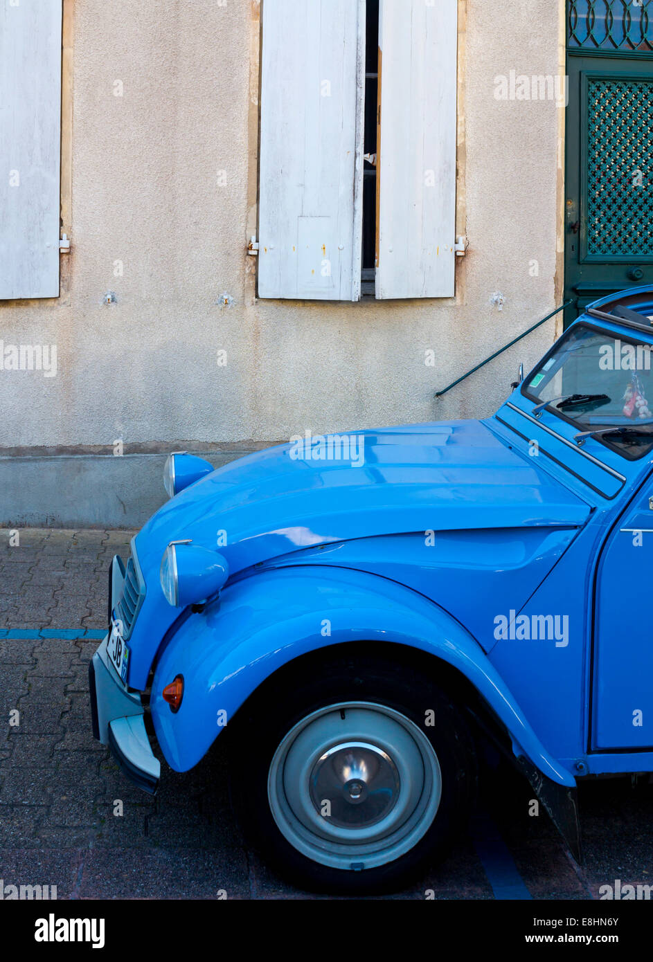 Blue Citroen 2CV car parked on a street in France nearly four million of these low cost cars were produced between 1948 and 1990 Stock Photo