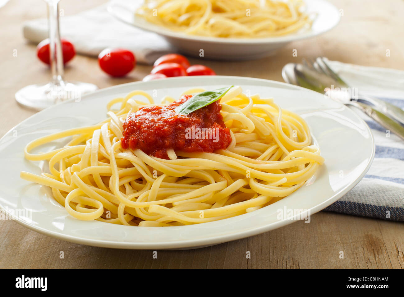 two dishes with spaghetti bolognesa on table Stock Photo