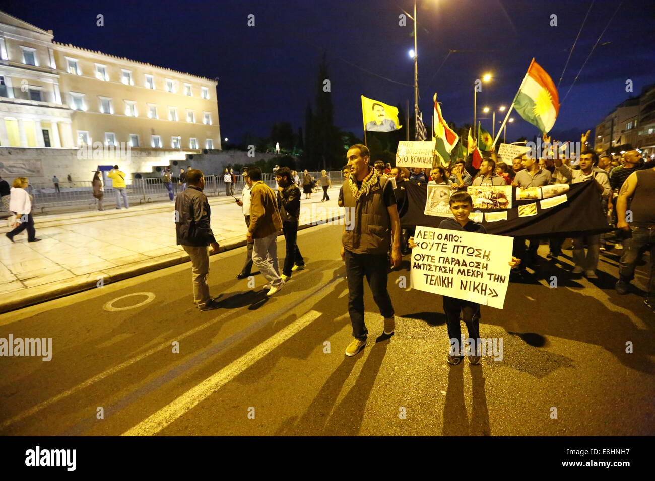 Athens, Greece. 8th October 2014. The protest march pases by the Greek parliament on Syntagma Square. Kurds living in Greece protested against the attacks of the Islamic State (IS) on the city of Kobane in Syria, calling for international support of the Kurdish fighters. They also protested against the alleged support of IS by the Turkish state. Credit:  Michael Debets/Alamy Live News Stock Photo