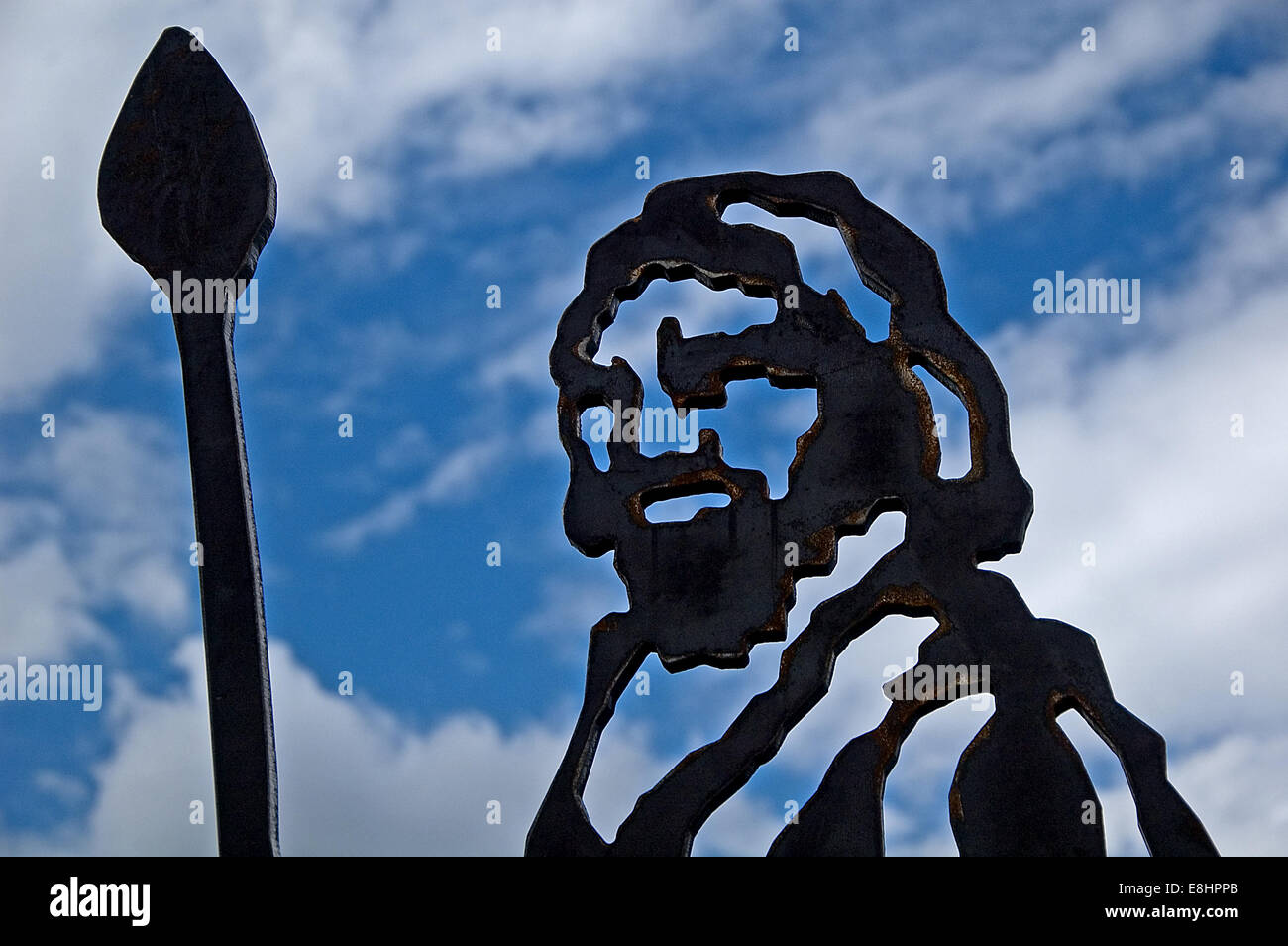 Statue of figures cut out from corten steel to create striking silhouette likenesses of people and animals. Stock Photo