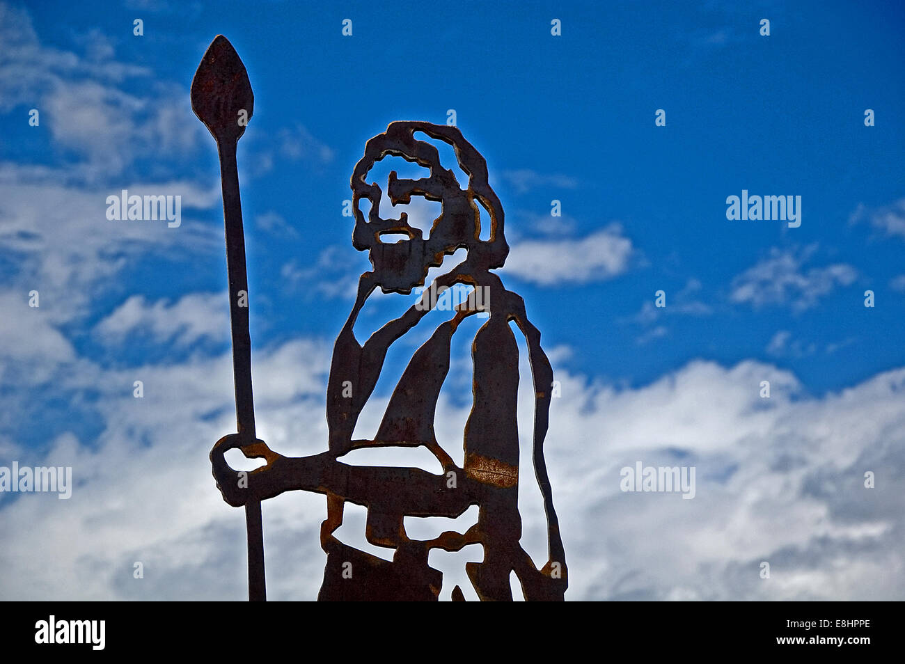 Statue of figures cut out from corten steel to create striking silhouette likenesses of people and animals. Stock Photo