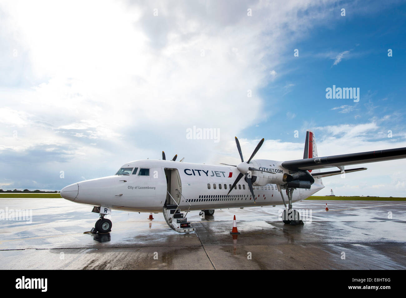 A CityJet Fokker 50 jet airplane preparing for a flight to Luxembourg at Cardiff Airport, South Wales. Stock Photo