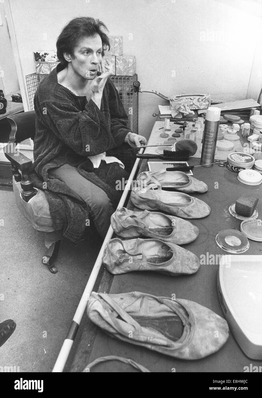 January 6, 1993 - RUDOLPH NUREYEV (March 17, 1938 - January 6, 1993) was a Soviet-born dancer of ballet and modern dance, one of the most celebrated of the 20th century. Nureyev's artistic skills explored expressive areas of the dance, providing a new role to the male ballet dancer who once served only as support to the women. Nureyev defected from the Soviet Union to the West in 1961, despite KGB efforts to stop him. Died from cardiac complications due to AIDS, at age 54 on January 6, 1993. PICTURED: Jun 20, 1977 - London, England, United Kingdom - RUDOLPH NUREYEV in his dressing room at the Stock Photo