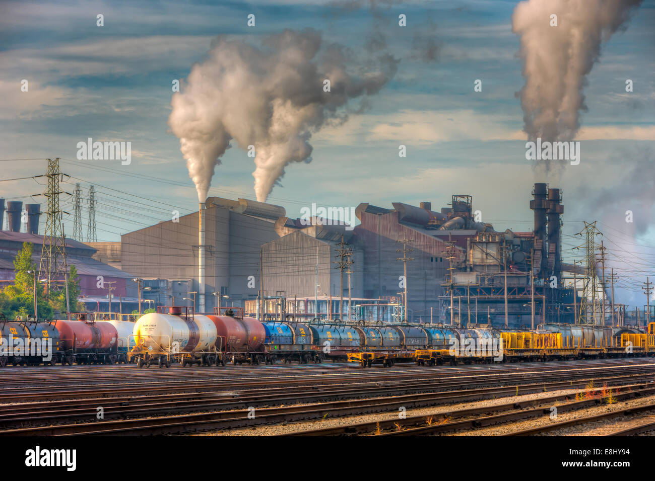 Steam rises from the smokestacks of the Arcelo Mittal steel mill in the Flats area of Cleveland, Ohio. Stock Photo