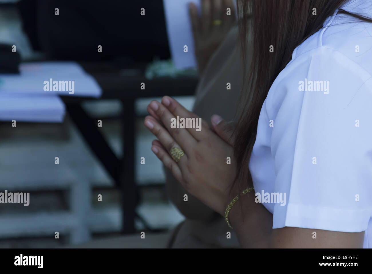 put the palms of the hands together in salute Stock Photo