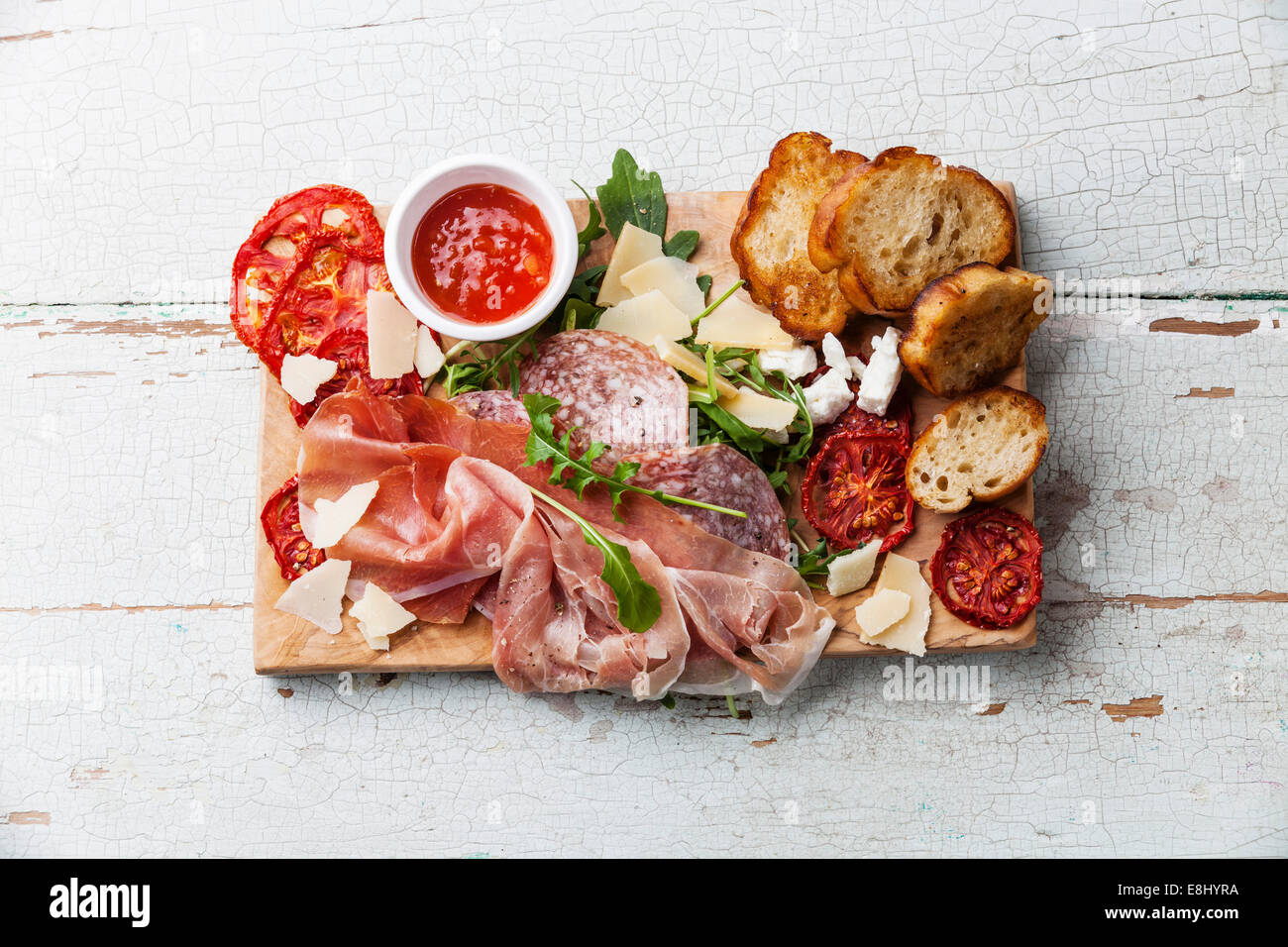 Cold meat plate and bread on wooden background Stock Photo