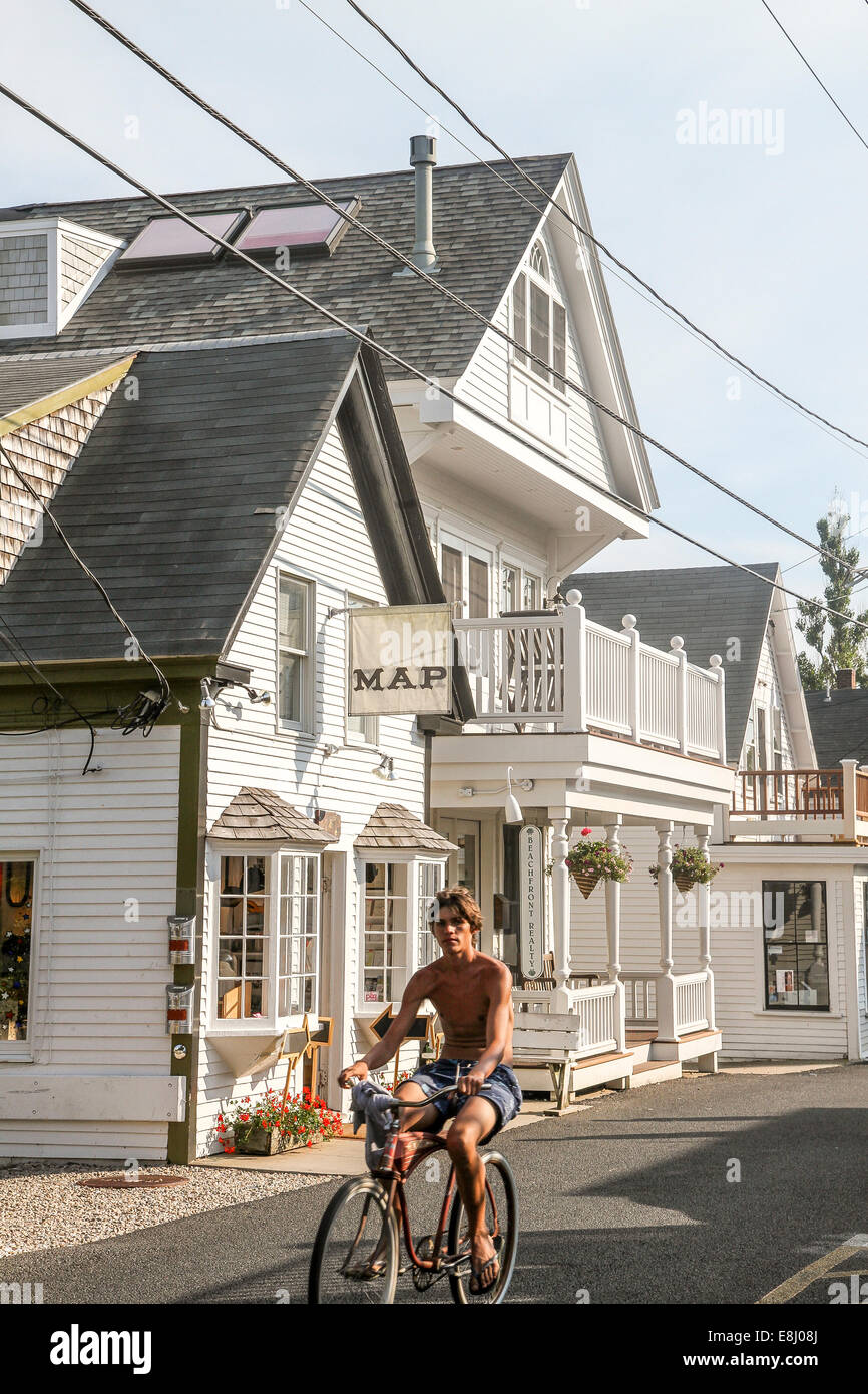 A young man on a bicycle in Provincetown, Massachusetts Stock Photo