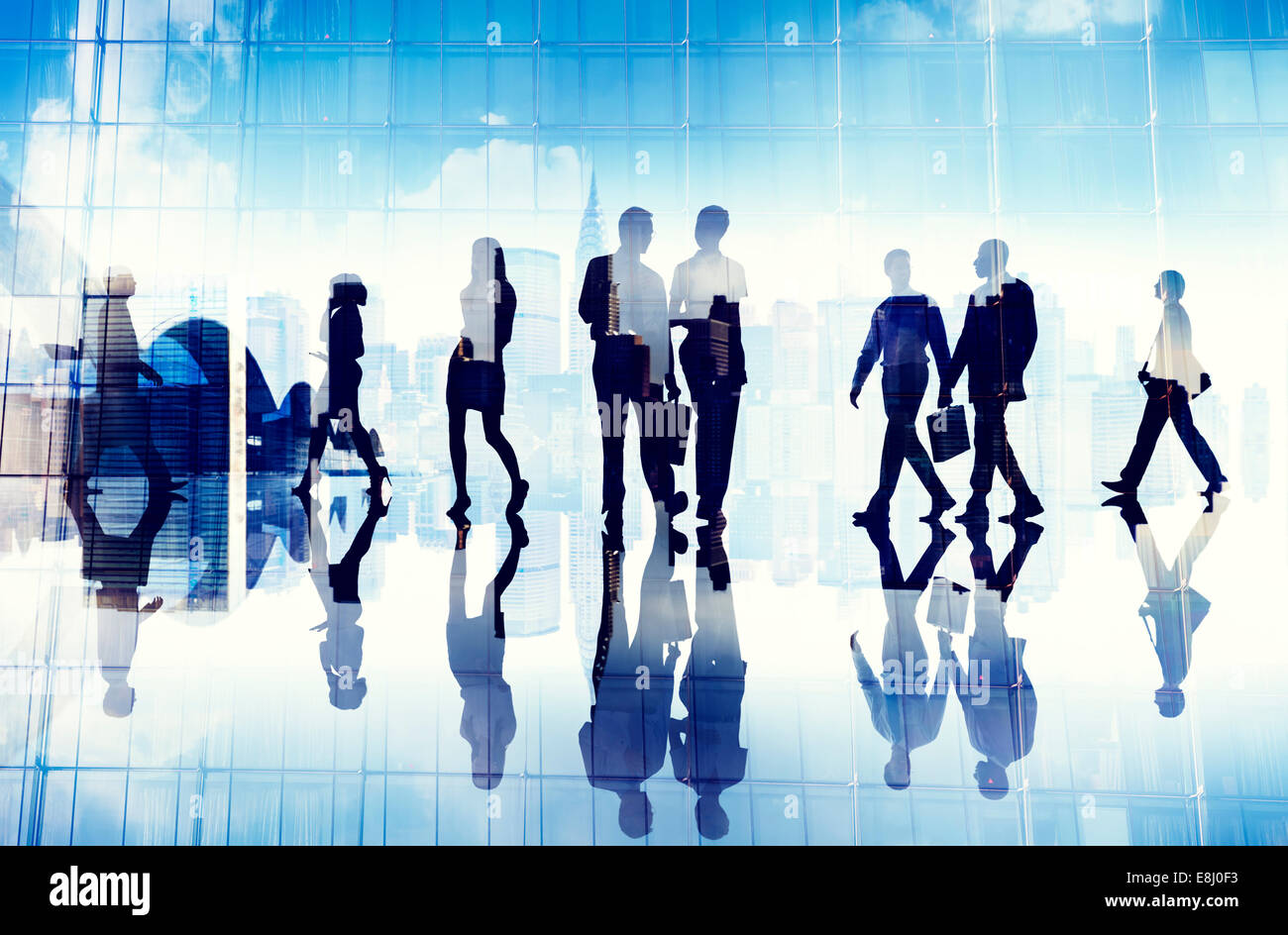 Silhouettes of Business People Walking inside the Office Stock Photo ...
