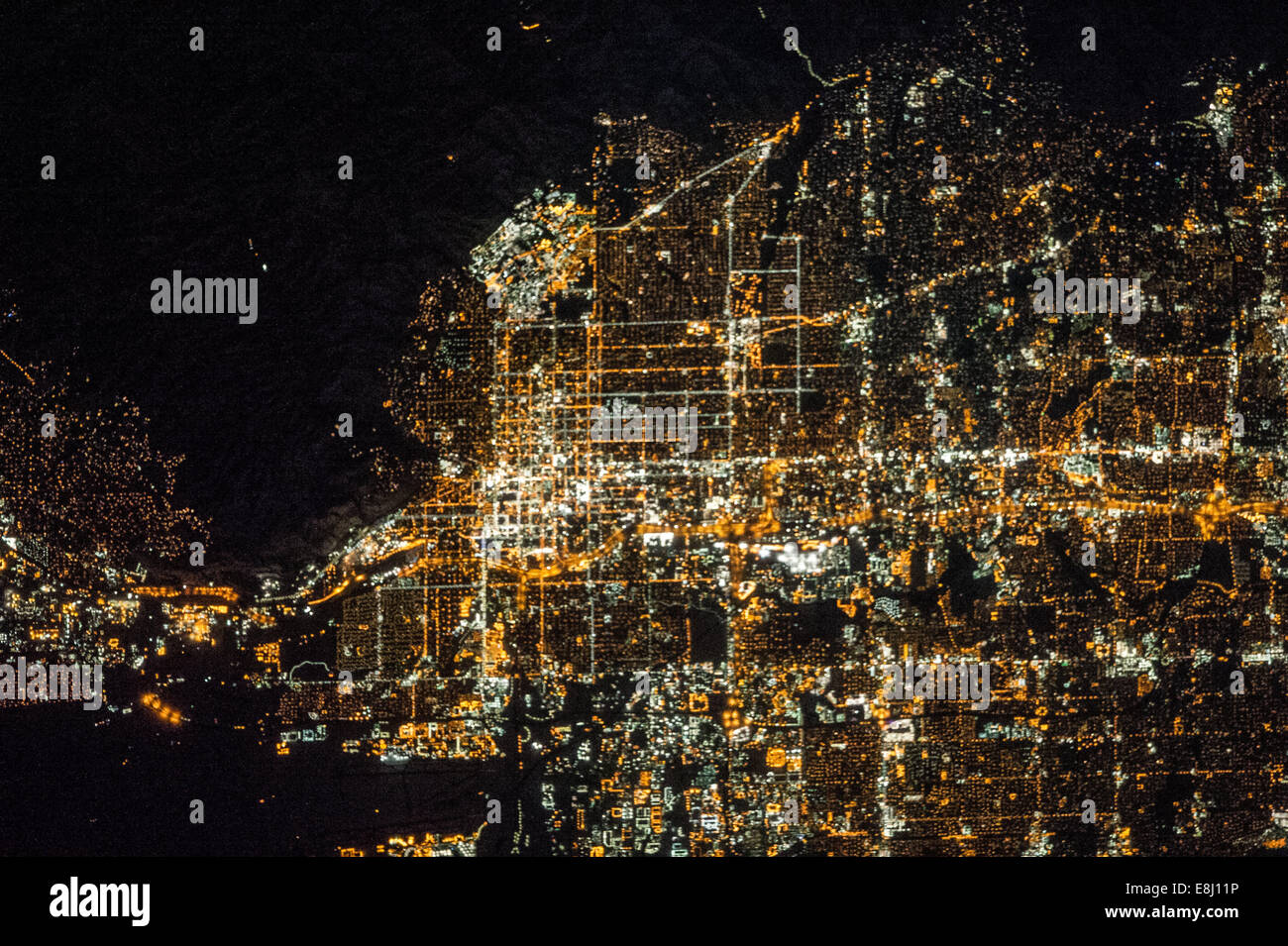 The Salt Lake City metropolitan area is located along the western front of the Wasatch Range in northern Utah. Viewed at night f Stock Photo