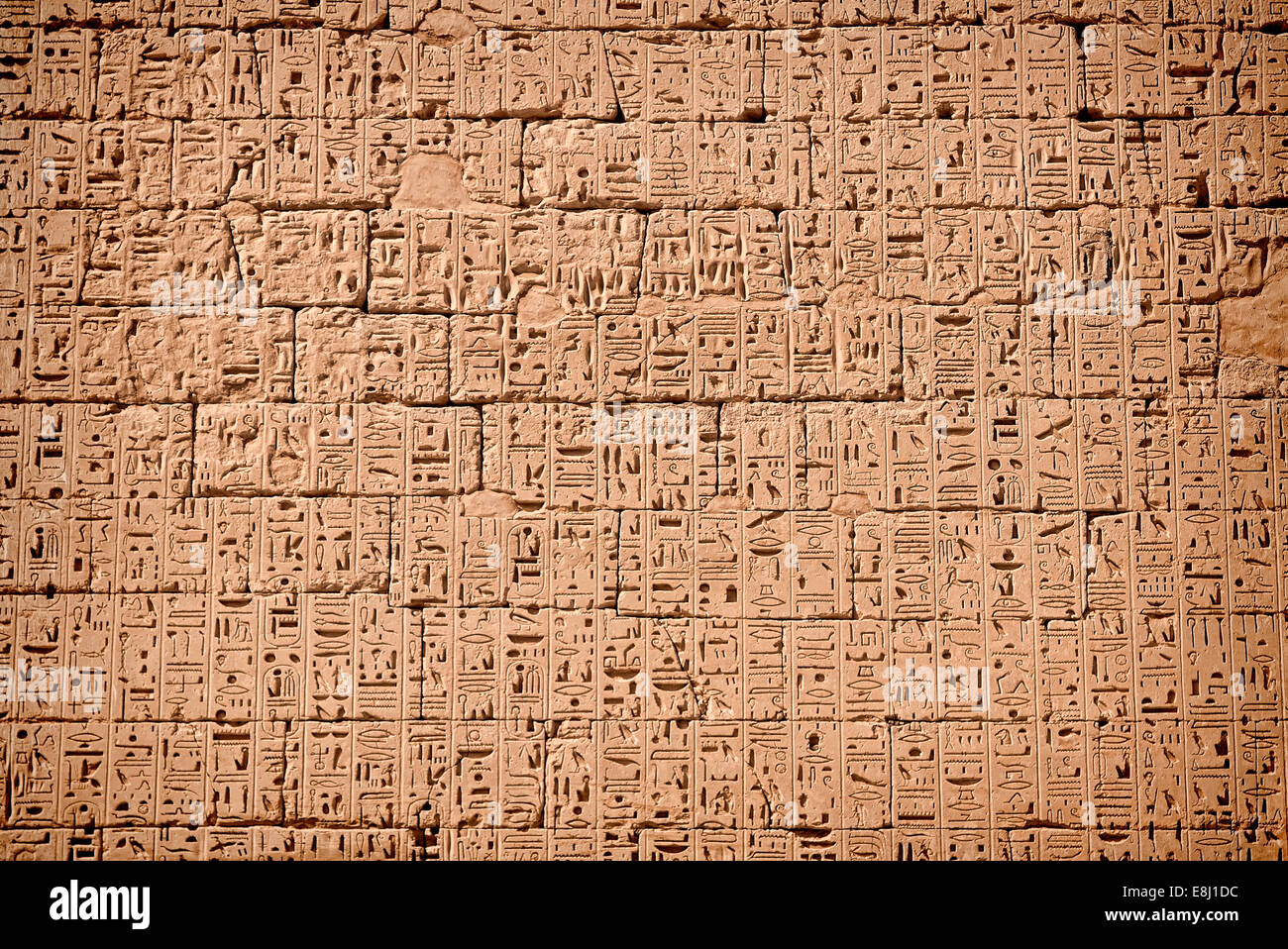 Wall full of sunk relief of hieroglyphics -temple King Ramses III (City of Habu) West of luxor 1100 B.C Stock Photo