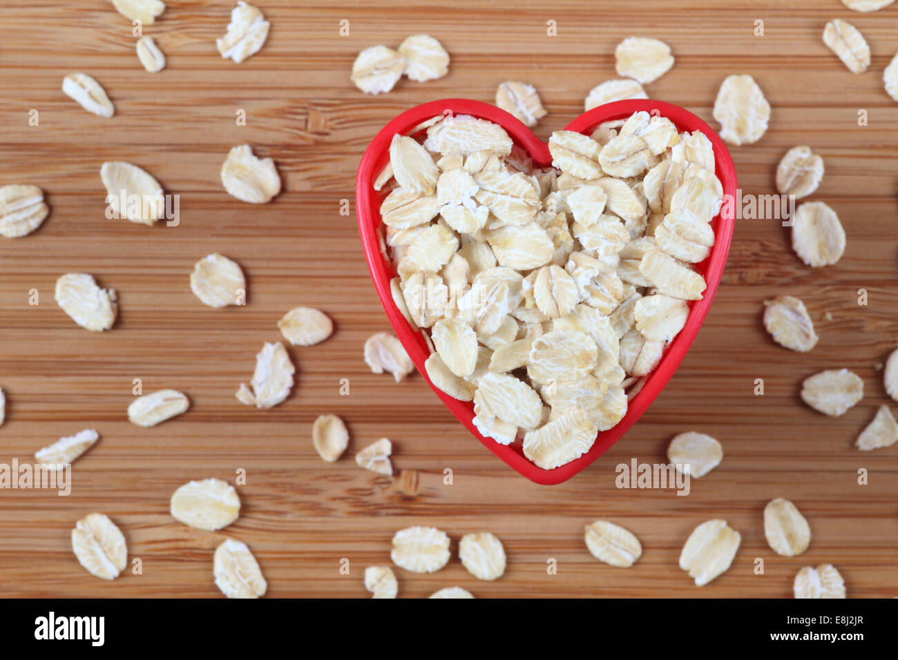 Oatmeal in a heart bowl. Close-up. Stock Photo