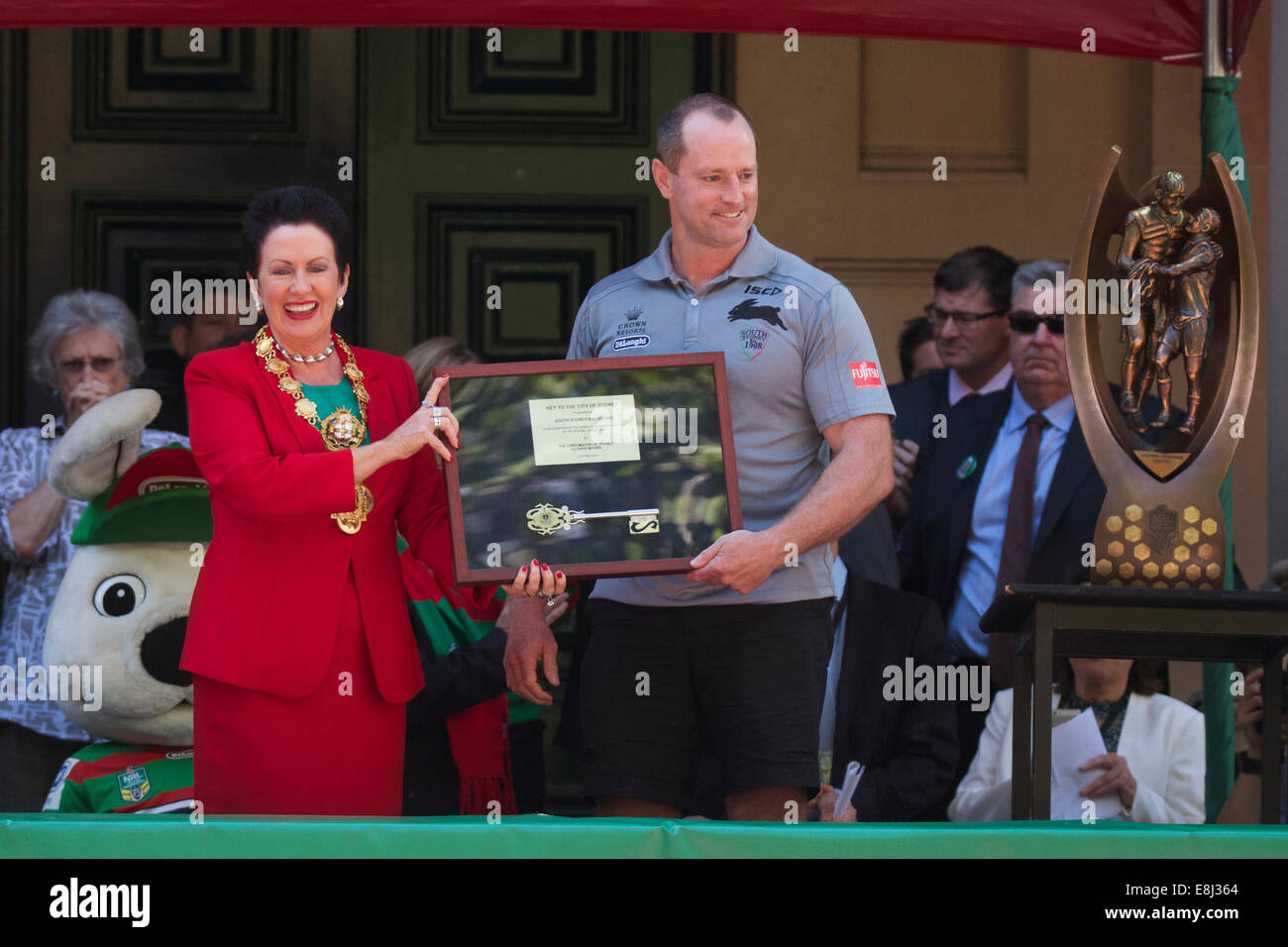 Sydney, NSW, Australia. 9th October 2014. After winning the NRL Grand Final, the South Sydney Rabbitohs were given the keys to the City of Sydney by the Lord Mayor at a ceremony in Sydney Square watched by fans of the rugby team. Pictured: Lord Mayor of Sydney Clover Moore presents South Sydney Rabbitohs Coach Michael Maguire with the keys to the City of Sydney, after the team won the NRL Grand Final. Copyright Credit:  2014 Richard Milnes/Alamy Live News. Stock Photo
