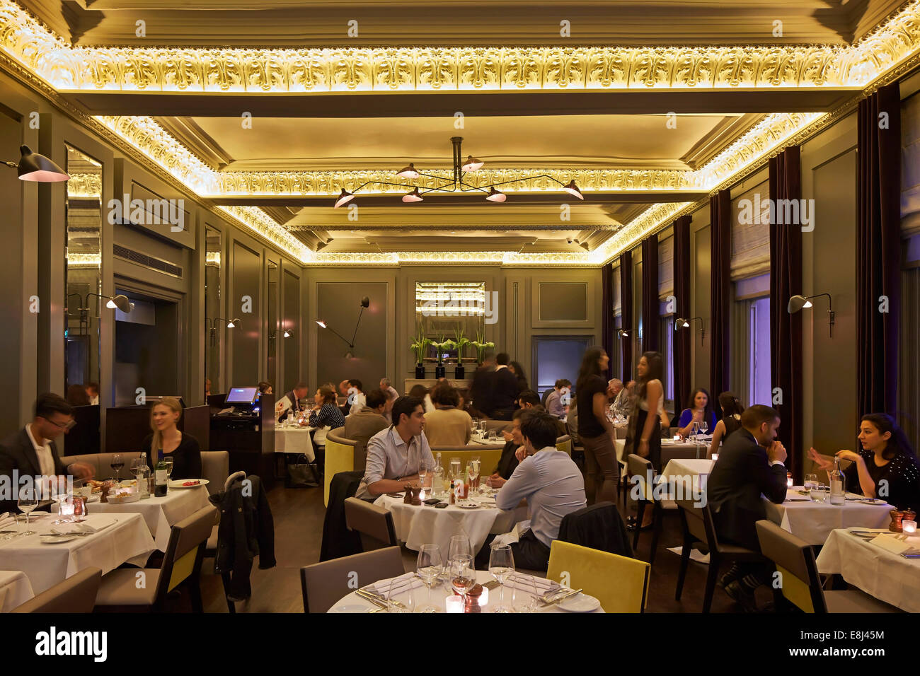 Christopher's, London, United Kingdom. Architect: De Matos Ryan, 2013. Dining room with guests. Stock Photo