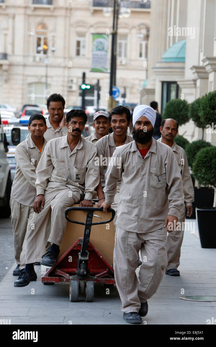 South Asian workers outside the Four Seasons Hotel, Baku Stock Photo