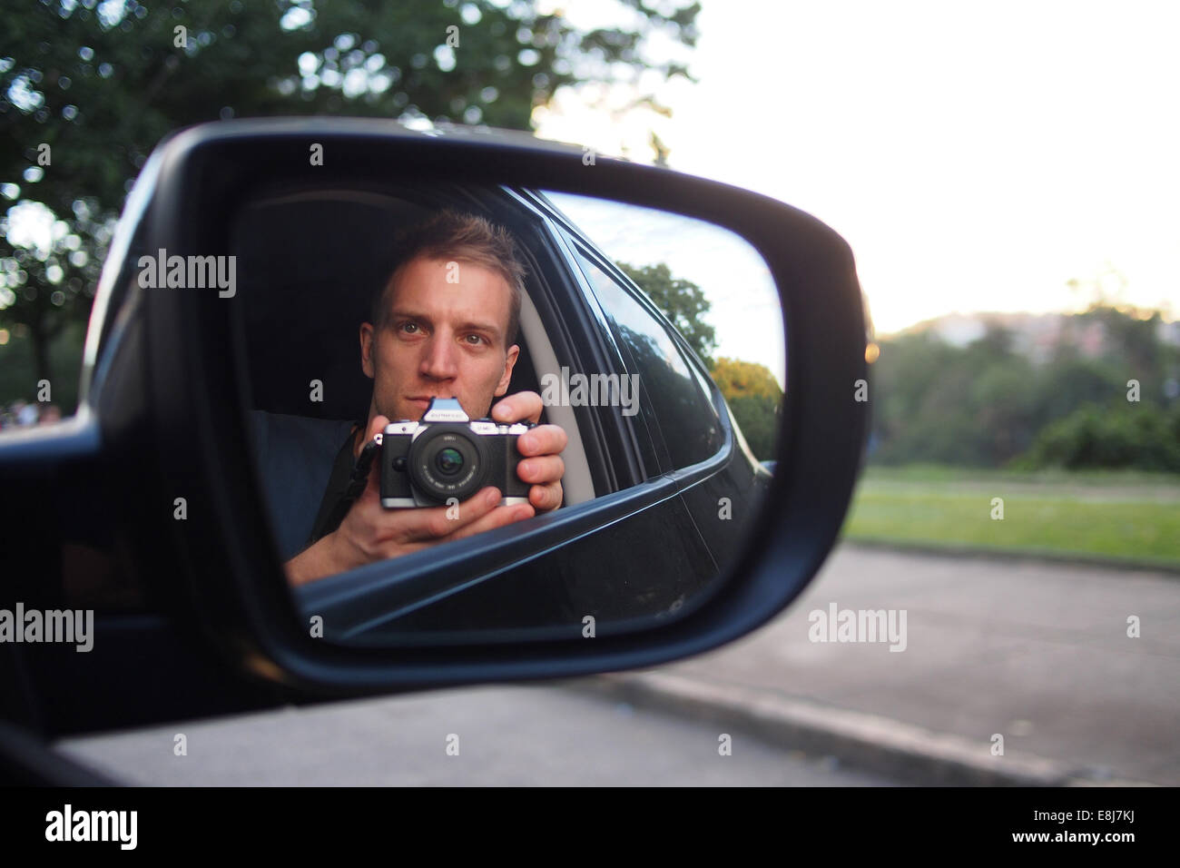 Photographer travelling in a car. Selfie. Stock Photo