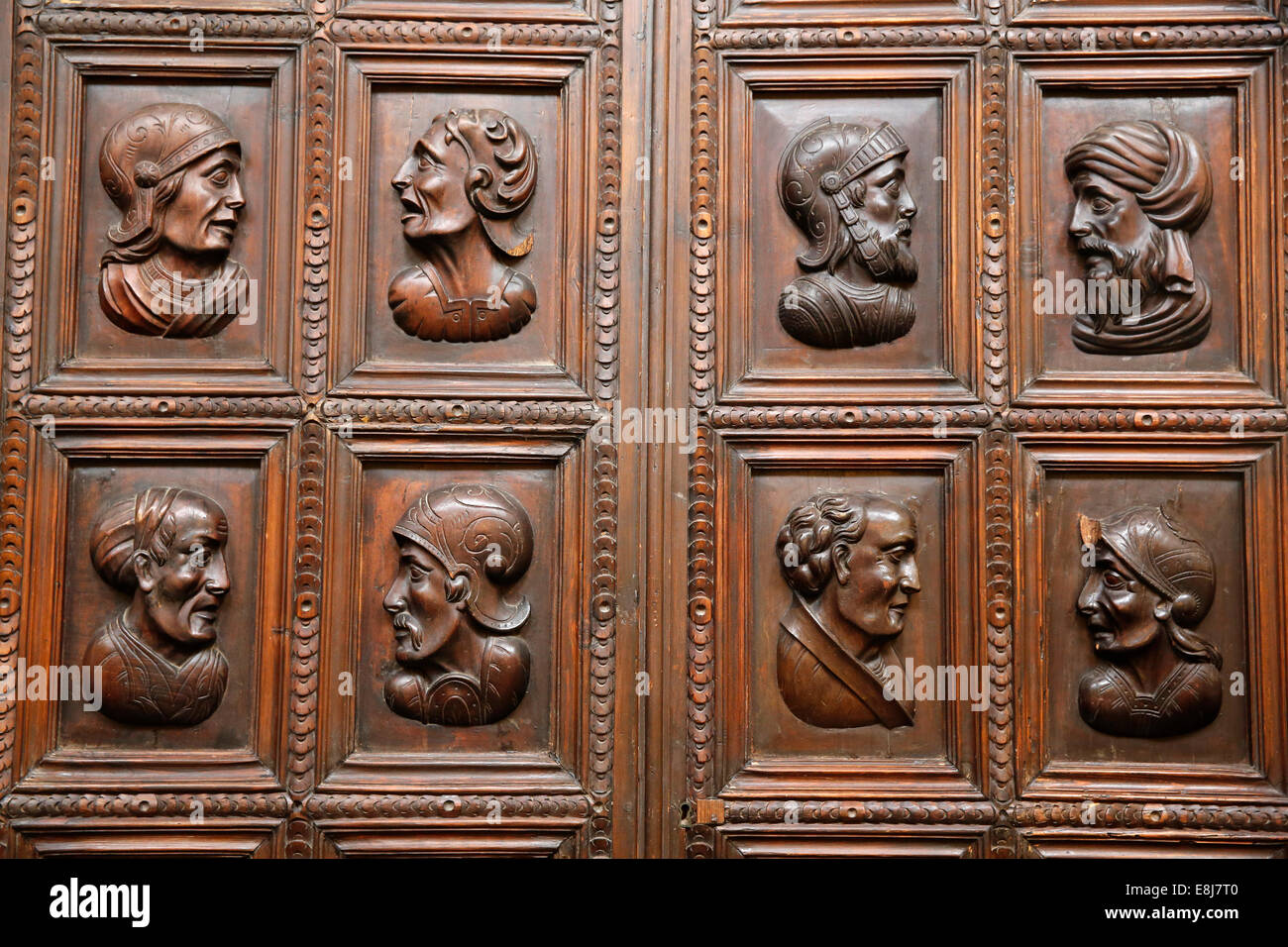 Two-panel door decorated with reliefs depicting characters related to the discovery of America and colonization of the New World Stock Photo