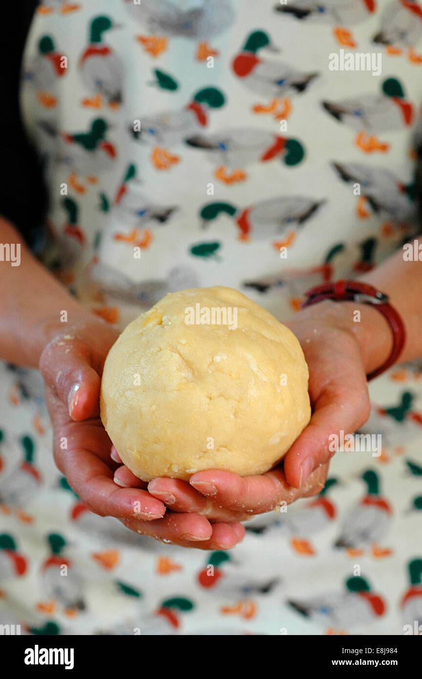 Woman holding dough Stock Photo