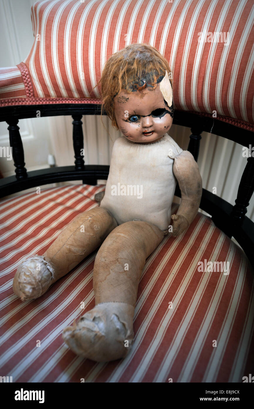 A battered childs doll UK Stock Photo