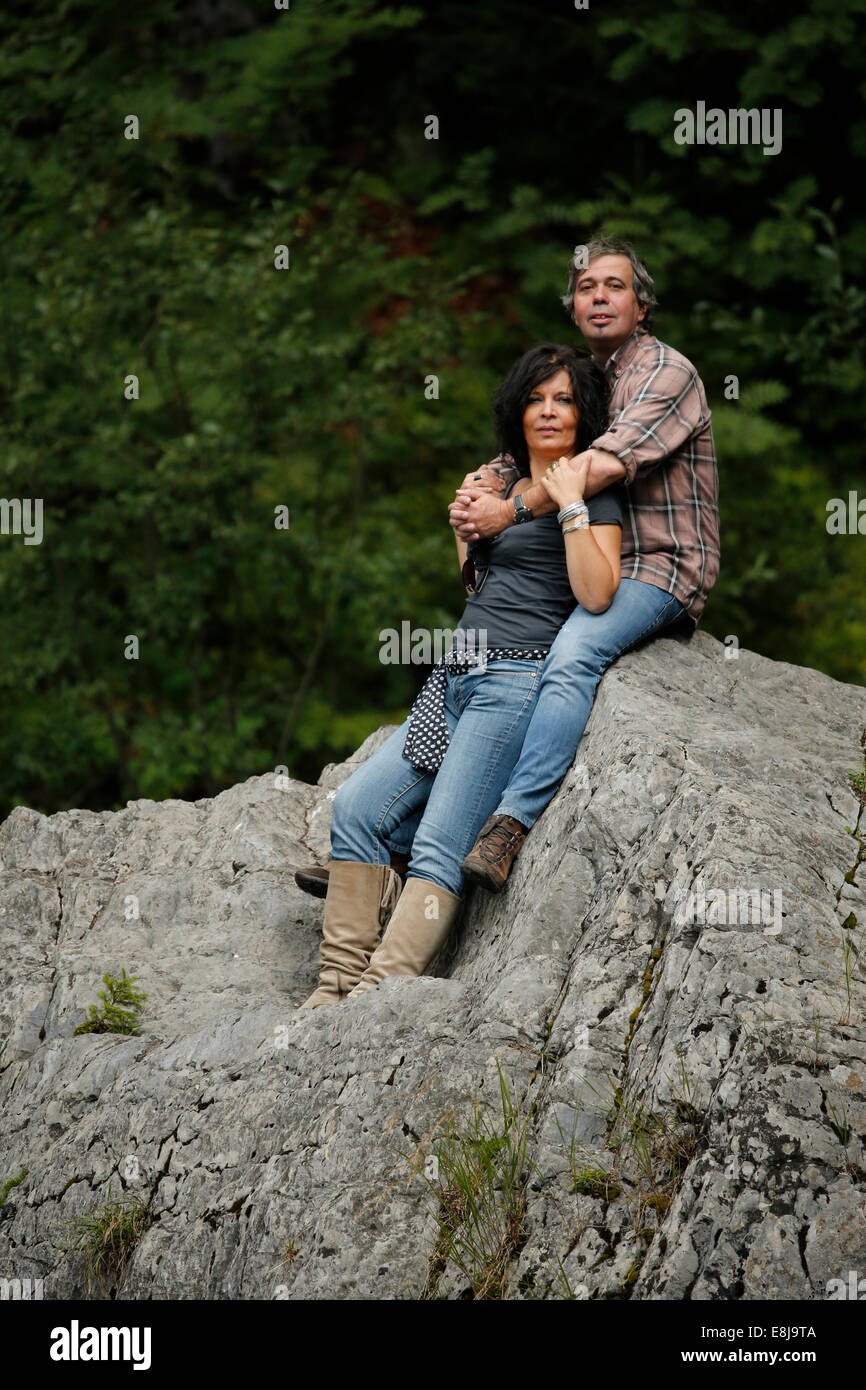 Couple on a rock Stock Photo - Alamy