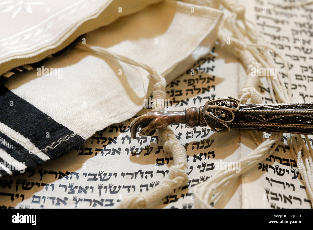 Torah scroll, Yad, Torah pointer, and Tallit, Jewish prayer shawl. Stock Photo