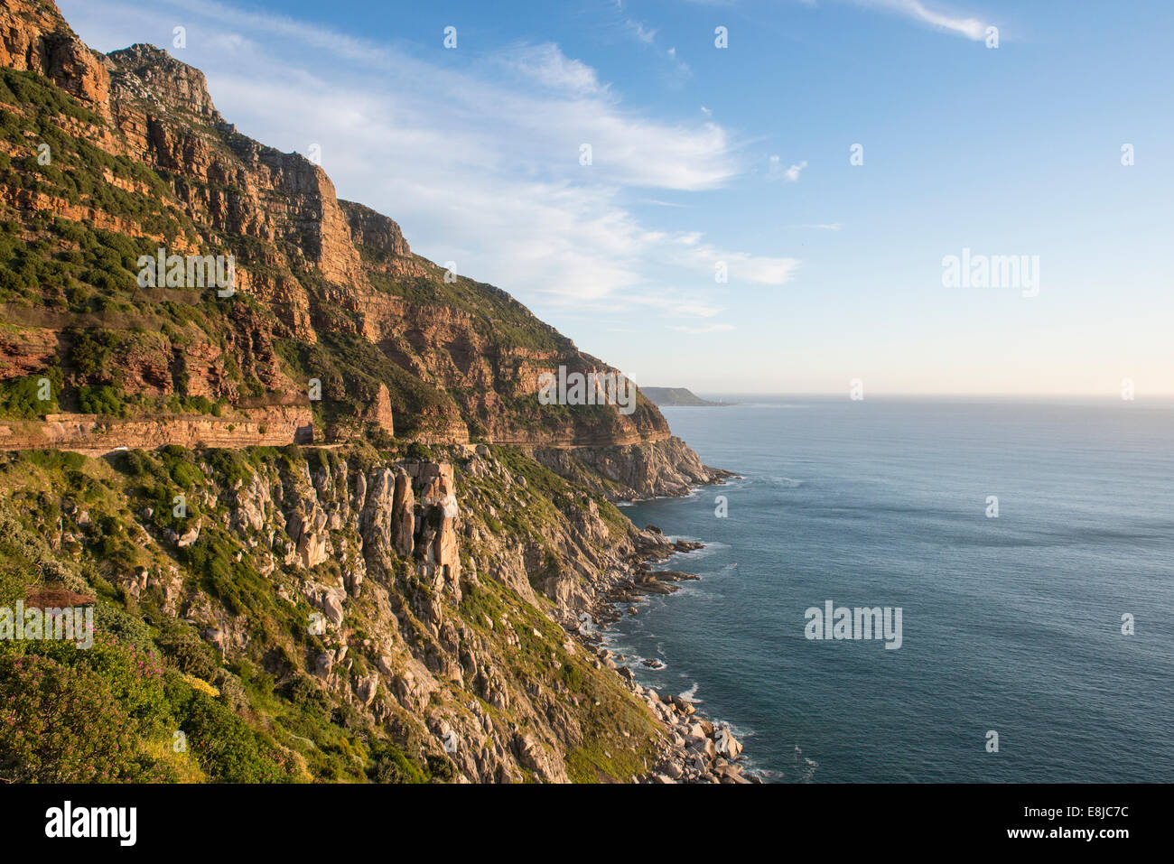 View south from Chapman's Peak along the steep coastline overlooking the Atlantic Ocean, Cape Town, South Africa Stock Photo