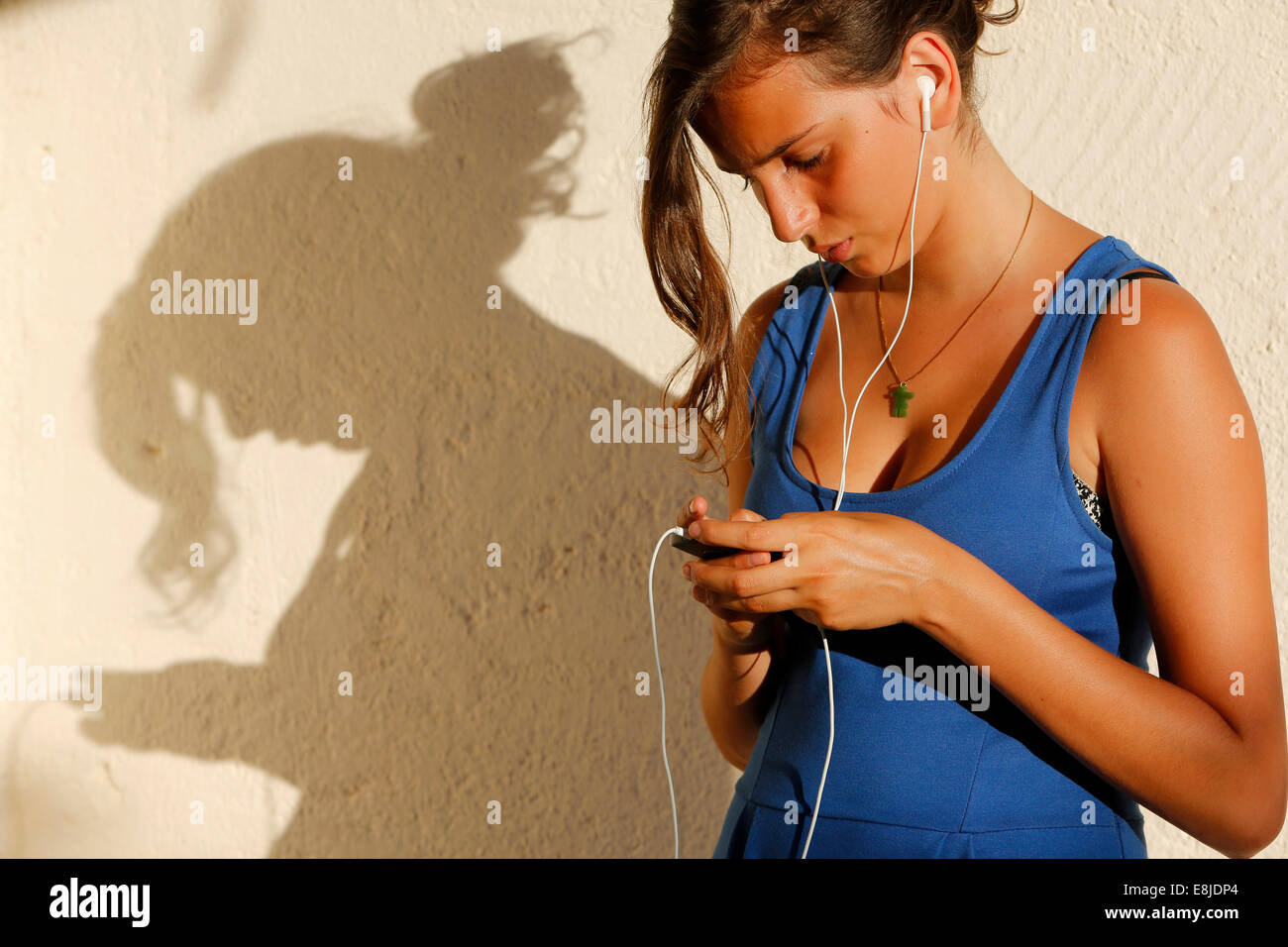 Teenager using a cell phone Stock Photo