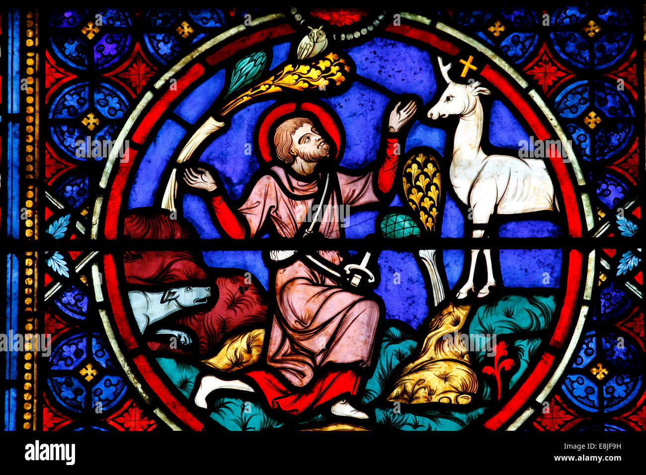 Notre Dame cathedral, Paris. Stained glass depicting Saint Hubert seeing a hart Stock Photo