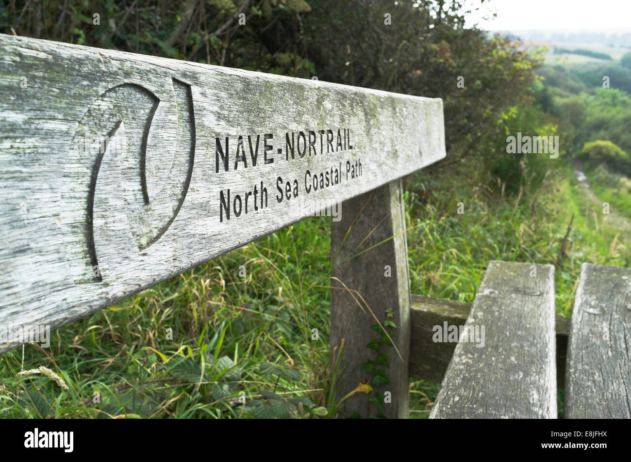 dh Footpath NORTH YORK MOORS YORKSHIRE North sea coastal path bench sign uk coast England Stock Photo