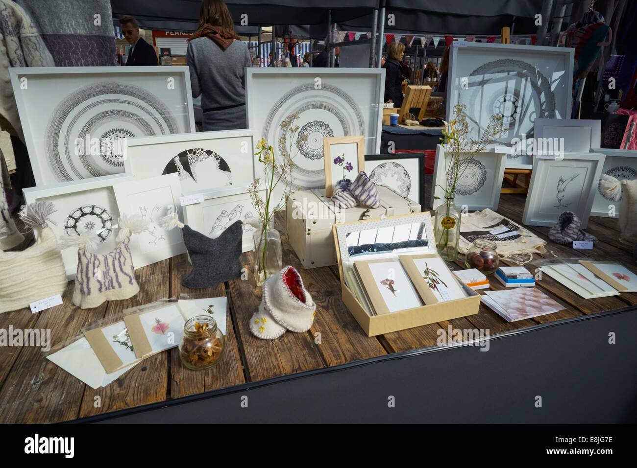 A stall in a craft fair in Altrincham Market, Cheshire showing miscellaneous hand made original items including cards Stock Photo