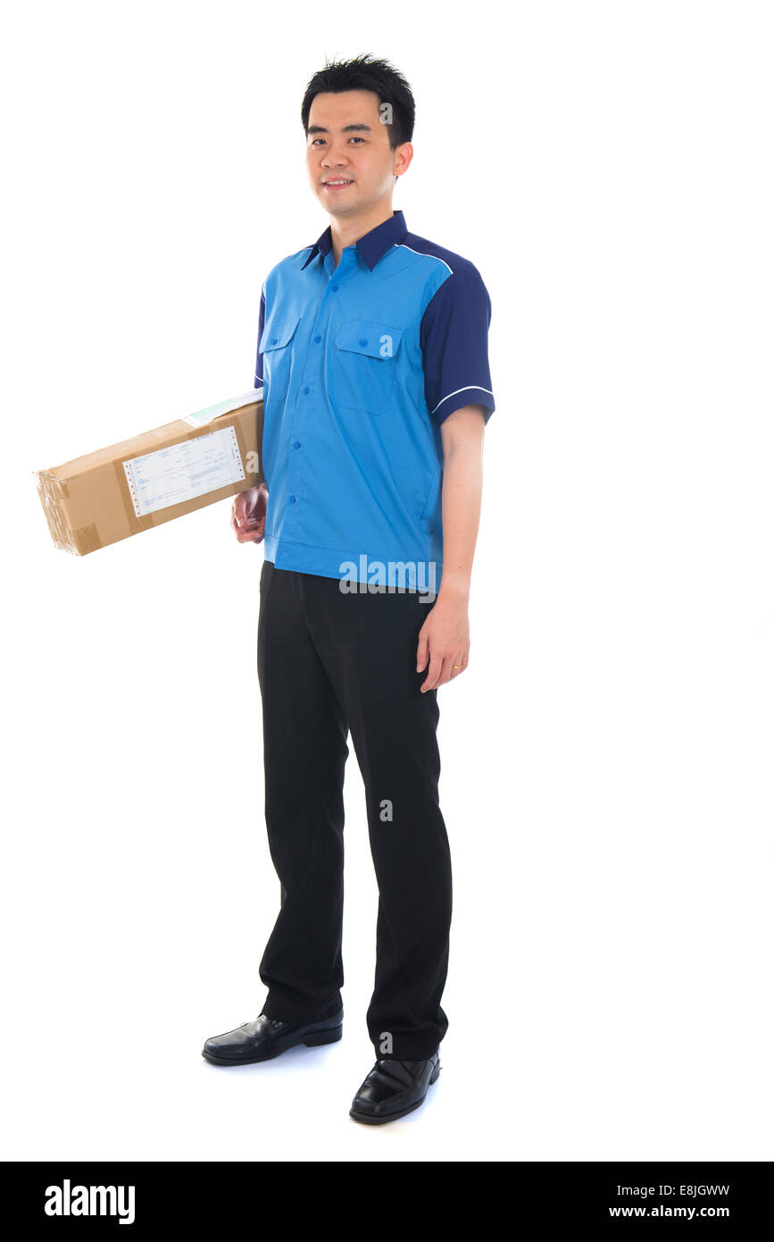 courier in blue uniform sending a package Stock Photo