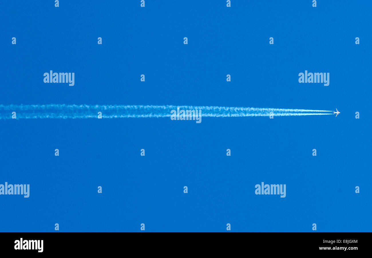 Plane in the sky Stock Photo - Alamy