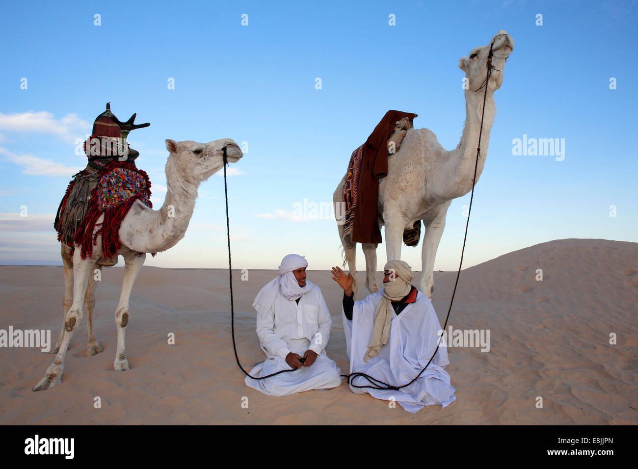 Beduins conversing in the Sahara Stock Photo