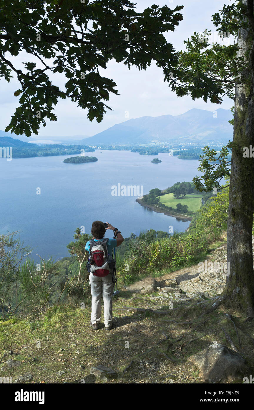 dh Surprise View DERWENT WATER LAKE DISTRICT Woman hiker taking viewpoint vista photograph cumbria people walker with camera photographer photos uk Stock Photo