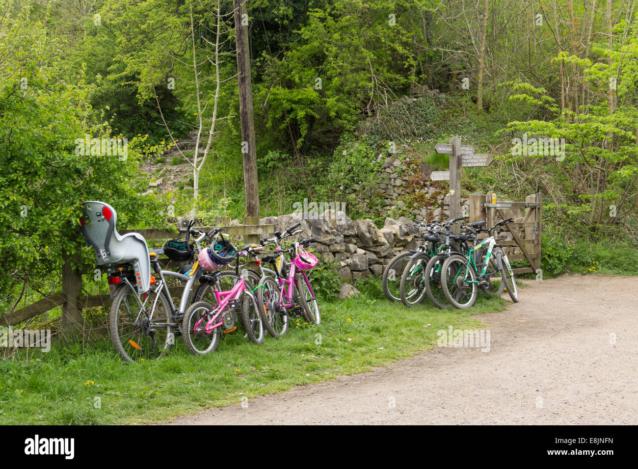 Bicycles on the Monsal Trail at Monsal Head where cyclists have left them to walk down the steep path into Monsal Dale itself. Stock Photo