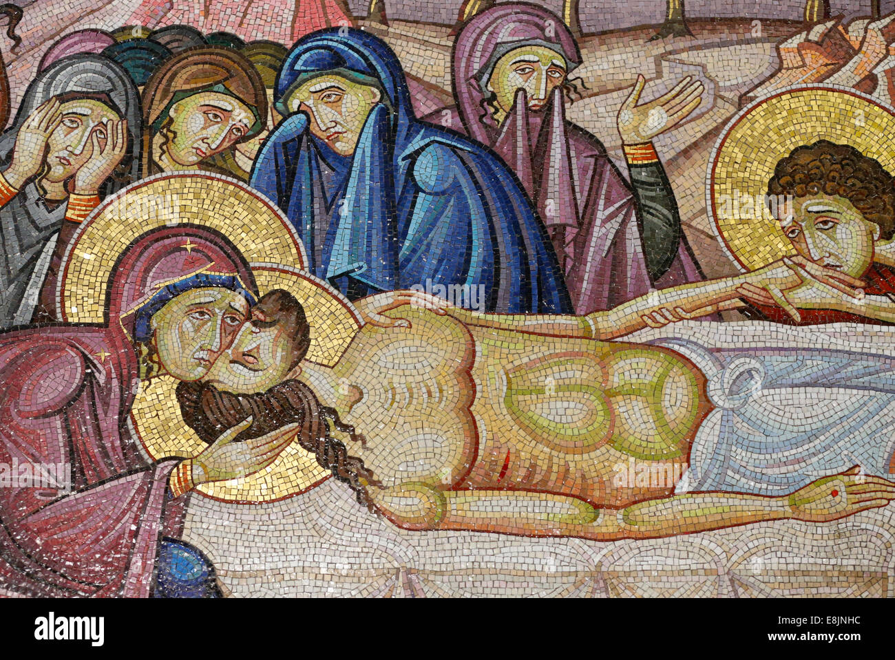 Jesus laid on the new tomb of Joseph of Arimathea. Detail of mosaic art which depicts the burial of Jesus Christ. Holy Sepulchre Stock Photo
