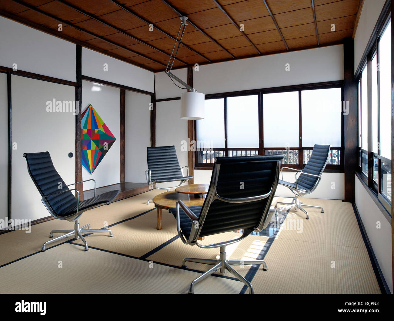Contemporary tatami room with Charles Eames office chairs in a japanese  apartment in Tokyo Stock Photo - Alamy