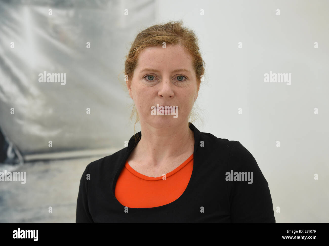 Photographer Ricarda Roggan poses in front of her series "Set" (2008