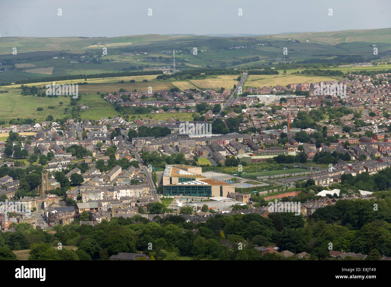 High angle townscape of Darwen, Lancashire. View north-east taken from Darwen Hil and looking over Darwen Leisure centre and the Stock Photo