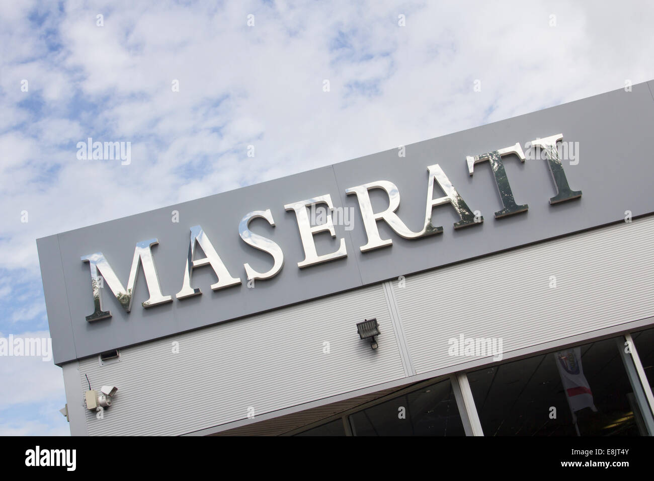 Maserati sign at Benfield Motors, Newcastle. Benfield  Motors is a large multi-franchise dealership for Maserati, Nissan et al. Stock Photo