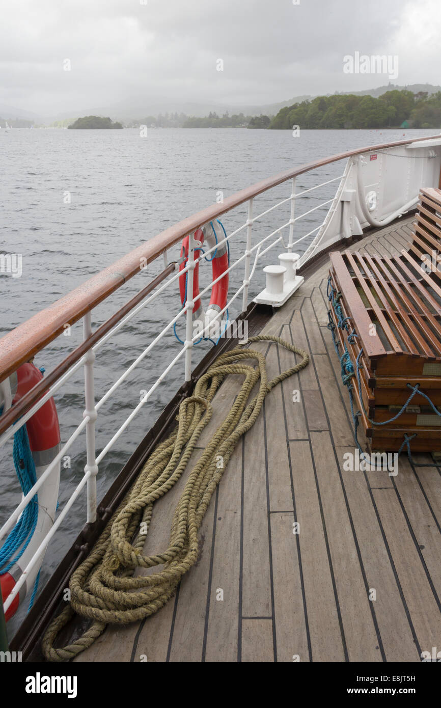 The front starboard side of Windermere steamer MV Swan with a mooring rope in a long coil on the deck. Stock Photo